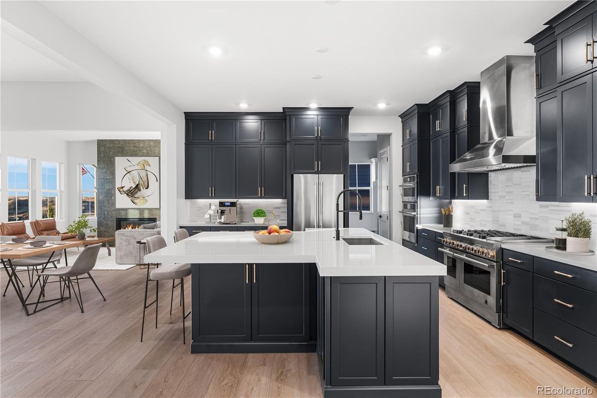 Dining room, Fireplace, Interior, Kitchen, Recessed Lighting, Stainless Steel Appliances, Wood Texture Flooring