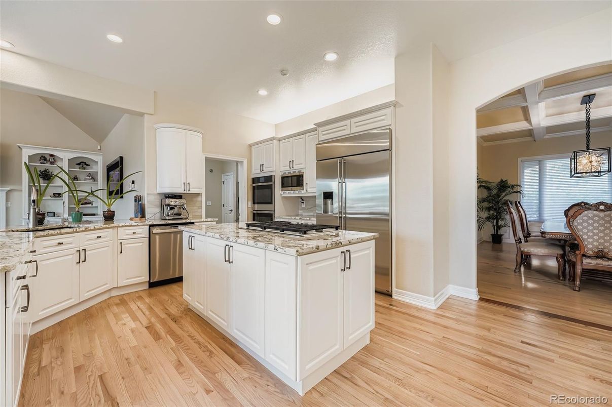 Dining room, Interior, Kitchen, Pendant Lights, Recessed Lighting, Stainless Steel Appliances, Wood Texture Flooring