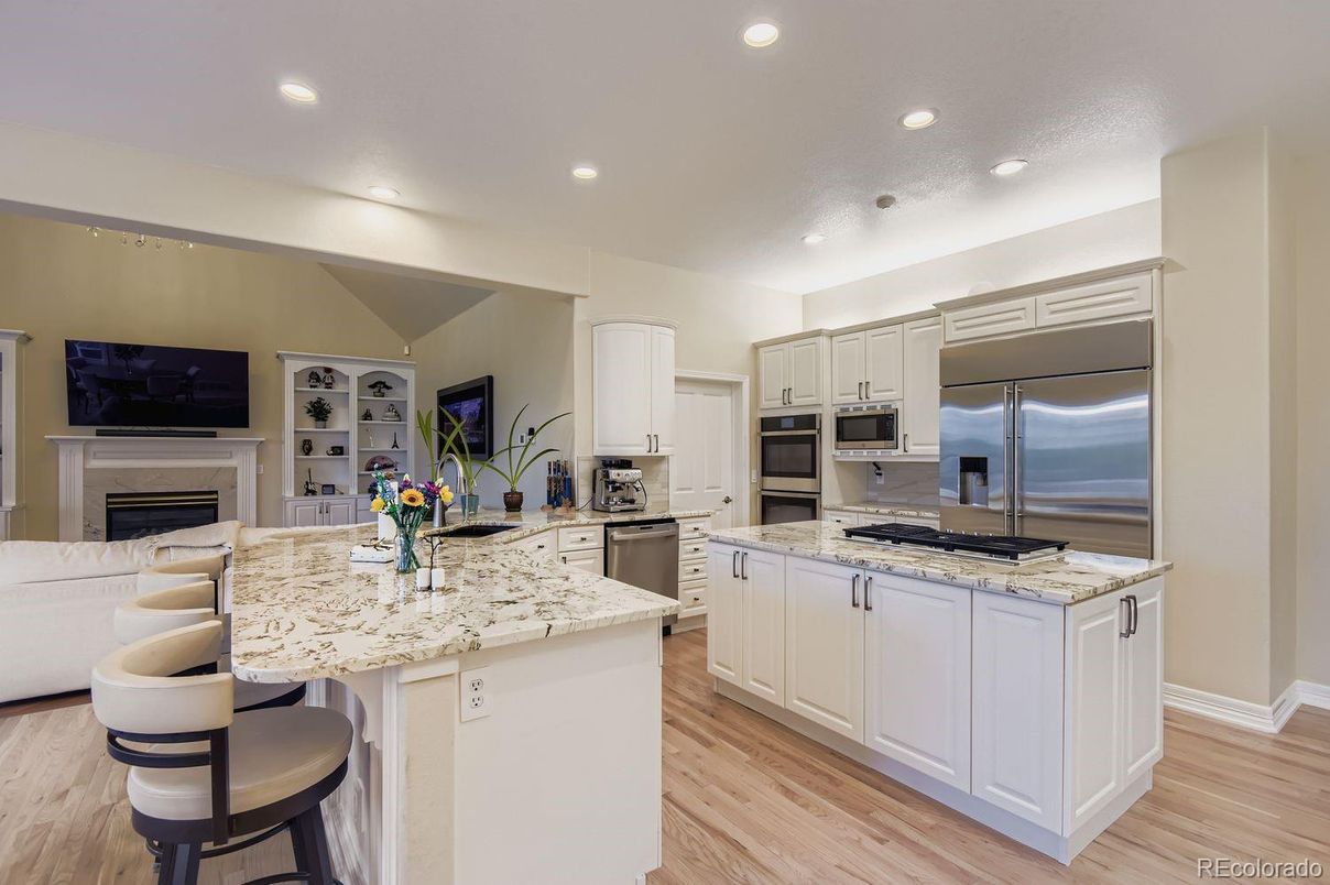 Fireplace, Interior, Kitchen, Recessed Lighting, Stainless Steel Appliances, Wood Texture Flooring