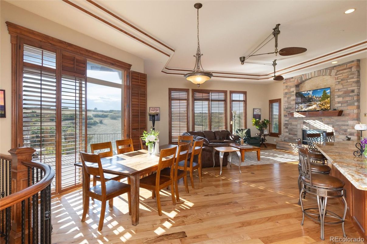 Dining room, Fireplace, Interior, Living room, Pendant Lights, Recessed Lighting, Stone Walls, Wood Texture Flooring