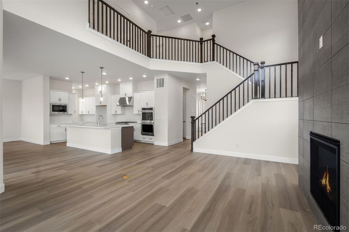 Fireplace, Interior, Kitchen, Pendant Lights, Recessed Lighting, Stainless Steel Appliances, Wood Texture Flooring