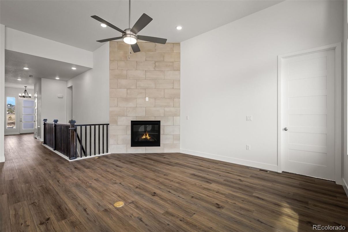 Empty room, Fireplace, Interior, Pendant Lights, Recessed Lighting, Stone Walls, Wood Texture Flooring