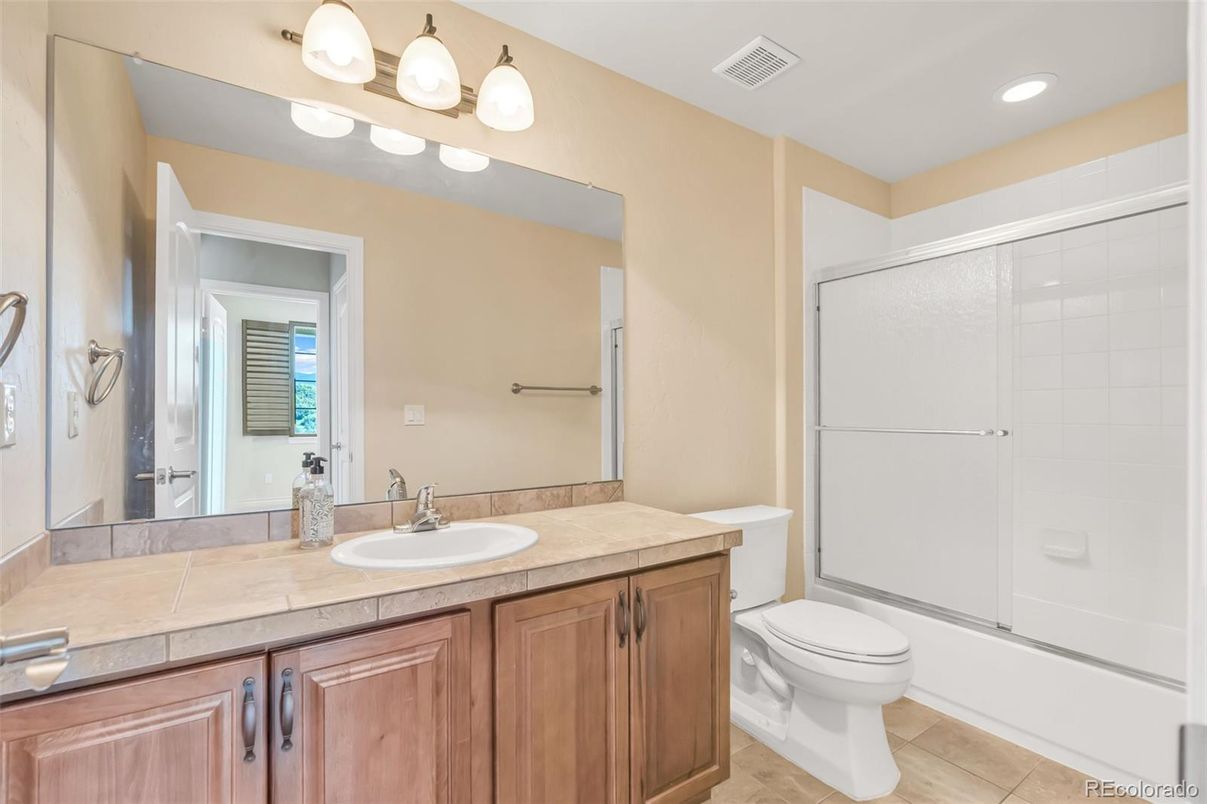 Bathroom, Dual Sink Vanities, Glass Shower, Interior, Recessed Lighting, Tile Countertops