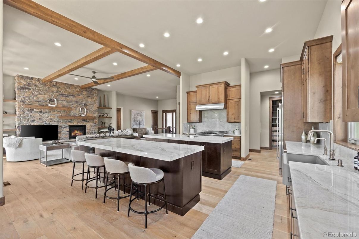 Fireplace, Interior, Kitchen, Living room, Recessed Lighting, Stainless Steel Appliances, Stone Walls, Wooden Beams, Wood Texture Flooring