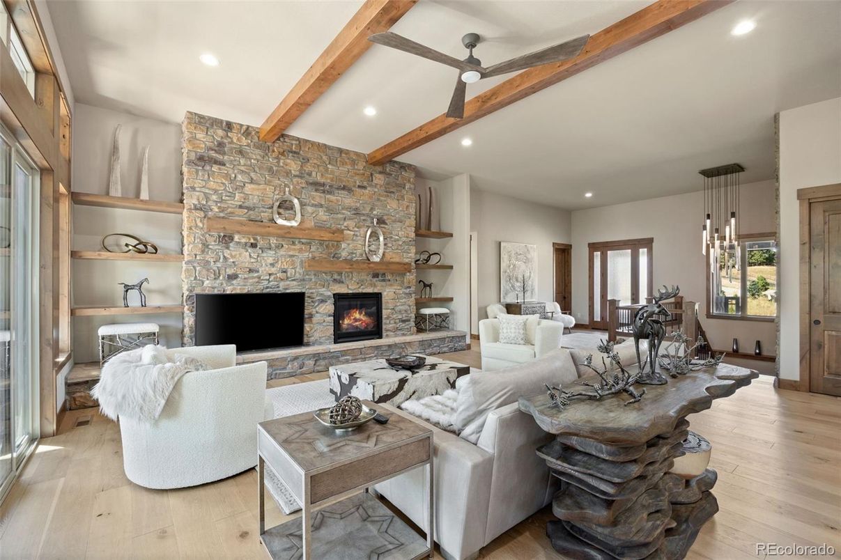 Dining room, Fireplace, Interior, Living room, Pendant Lights, Recessed Lighting, Stone Walls, Wooden Beams, Wood Texture Flooring