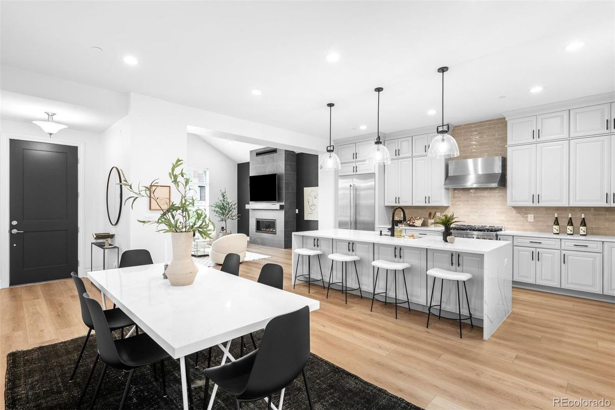 Dining room, Fireplace, Interior, Kitchen, Pendant Lights, Recessed Lighting, Stainless Steel Appliances, Wood Texture Flooring