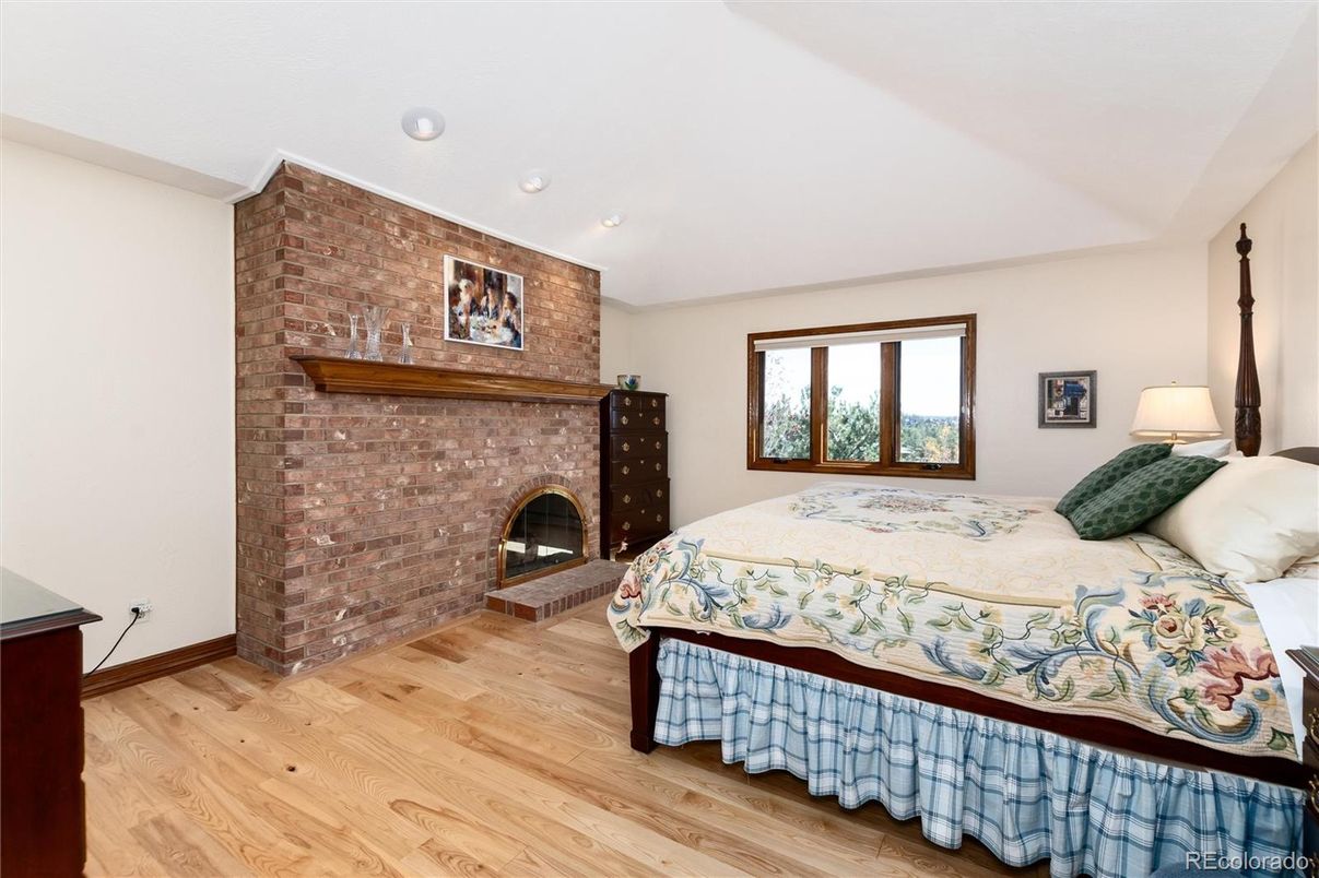 Bedroom, Fireplace, Interior, Recessed Lighting, Stone Walls, Wood Texture Flooring