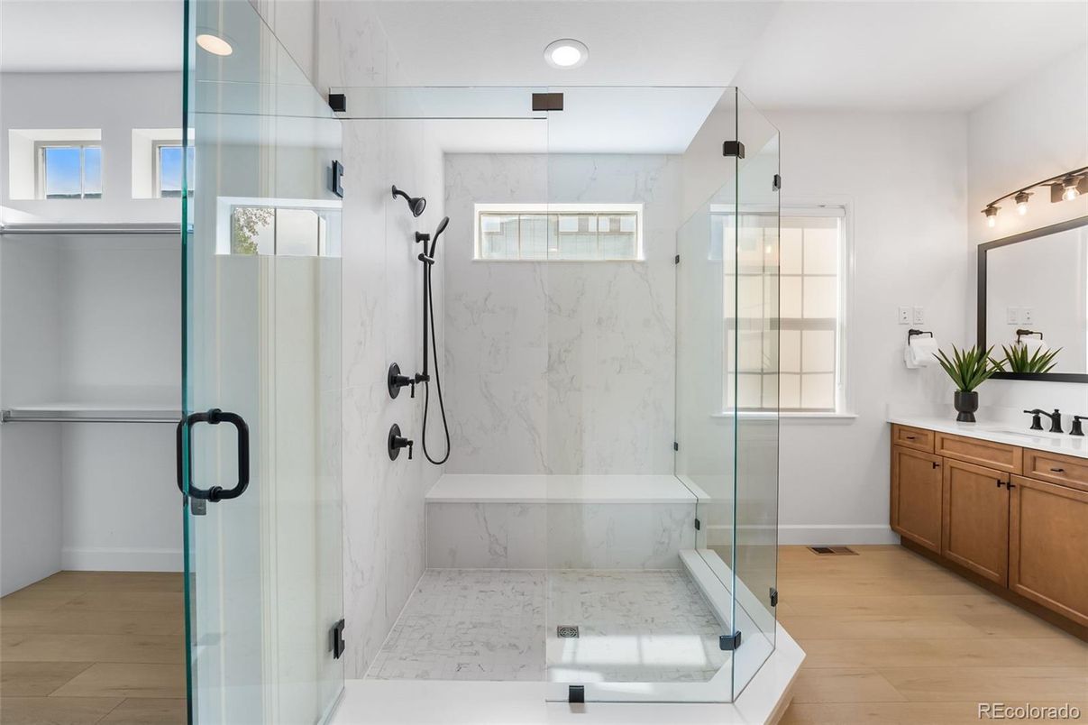 Bathroom, Glass Shower, Interior, Marble Walls, Recessed Lighting, Wood Texture Flooring