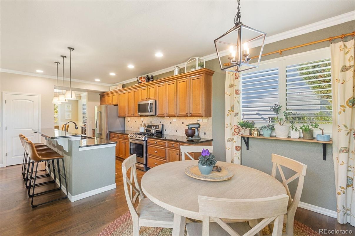 Dining room, Interior, Kitchen, Pendant Lights, Recessed Lighting, Stainless Steel Appliances, Wood Texture Flooring