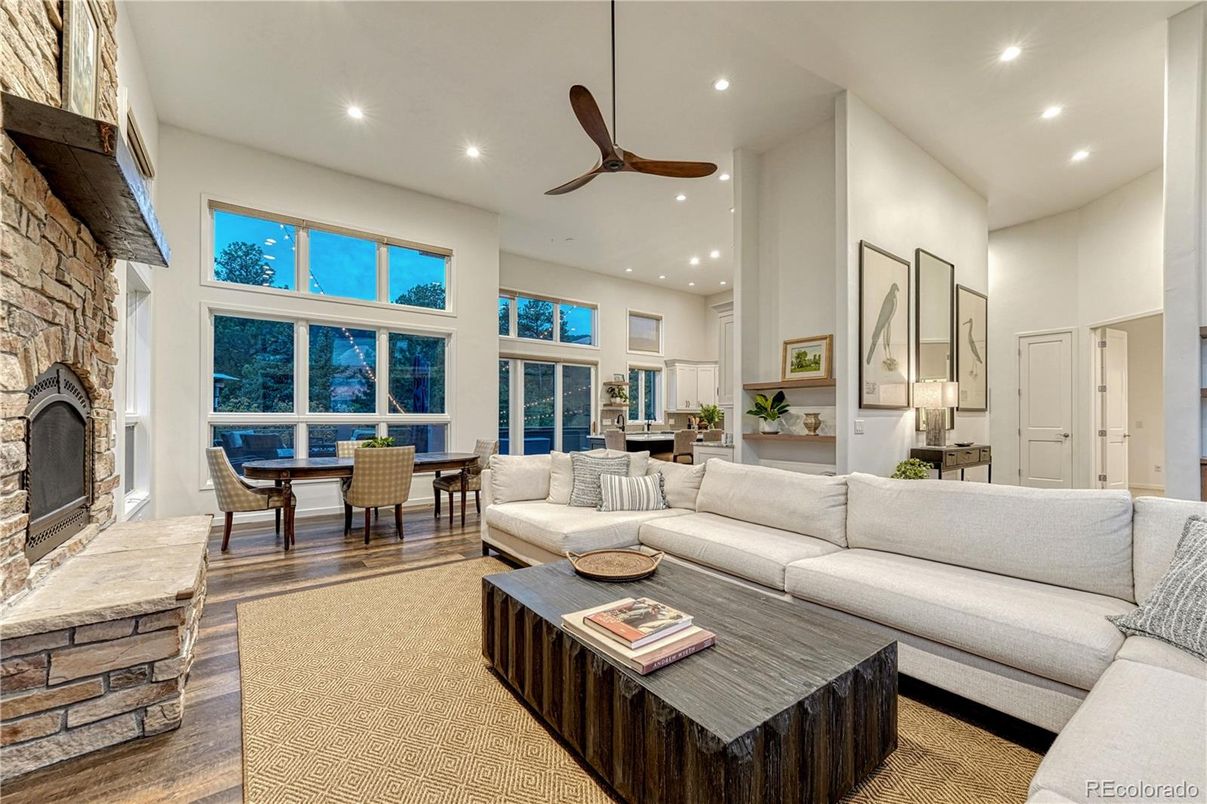 Dining room, Fireplace, Interior, Living room, Recessed Lighting, Stone Walls, Wood Texture Flooring