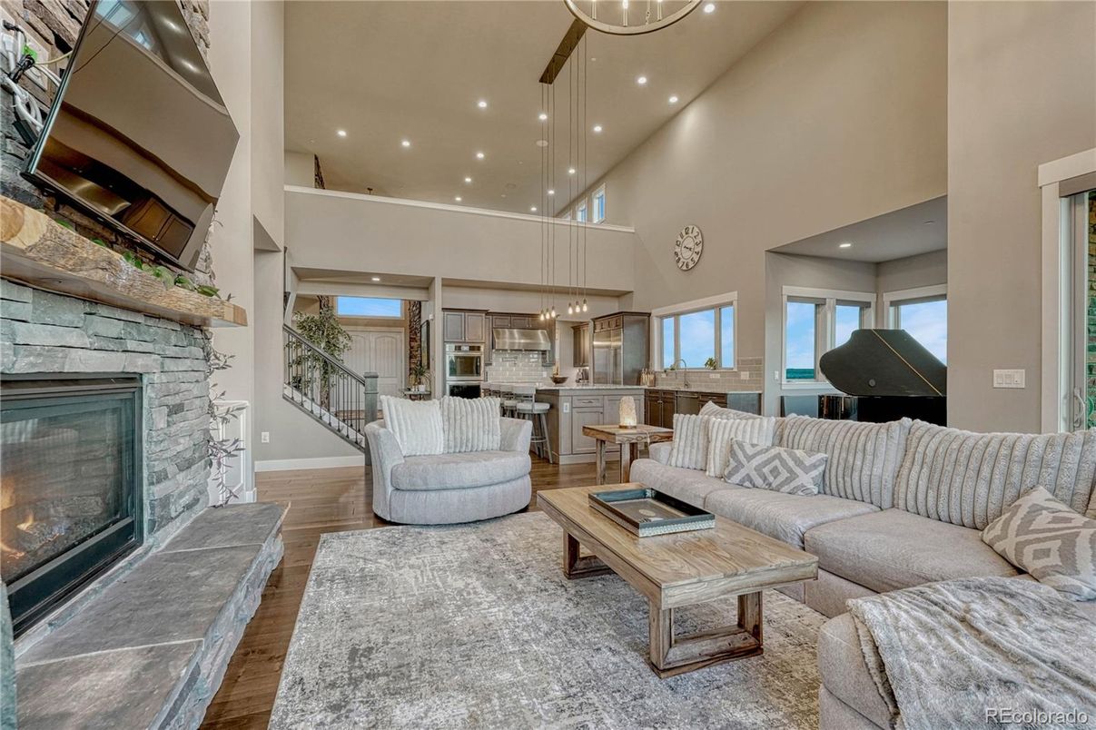 Fireplace, Interior, Living room, Pendant Lights, Piano, Recessed Lighting, Stone Walls, Wood Texture Flooring