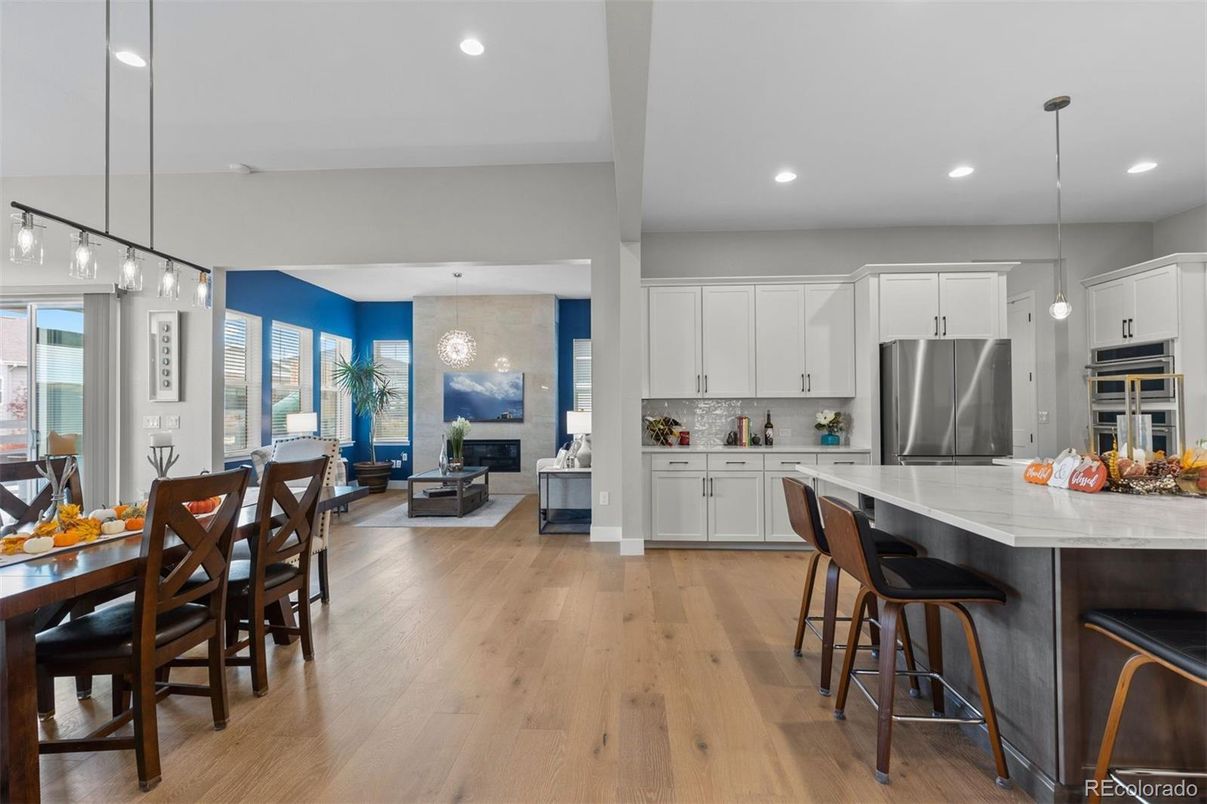 Dining room, Fireplace, Interior, Kitchen, Pendant Lights, Recessed Lighting, Stainless Steel Appliances, Wood Texture Flooring