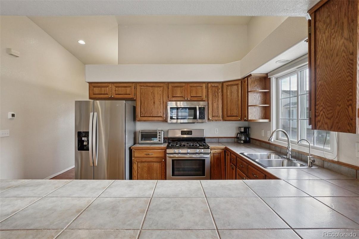 Interior, Kitchen, Recessed Lighting, Stainless Steel Appliances, Tile Countertops