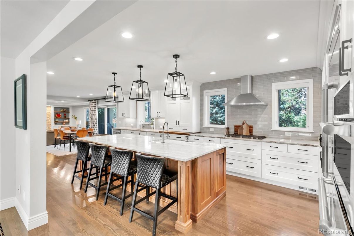 Dining room, Interior, Kitchen, Pendant Lights, Recessed Lighting, Stainless Steel Appliances, Wood Texture Flooring