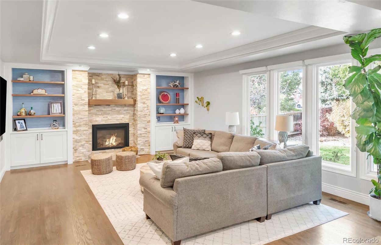 Fireplace, Interior, Living room, Recessed Lighting, Stone Walls, Wood Texture Flooring