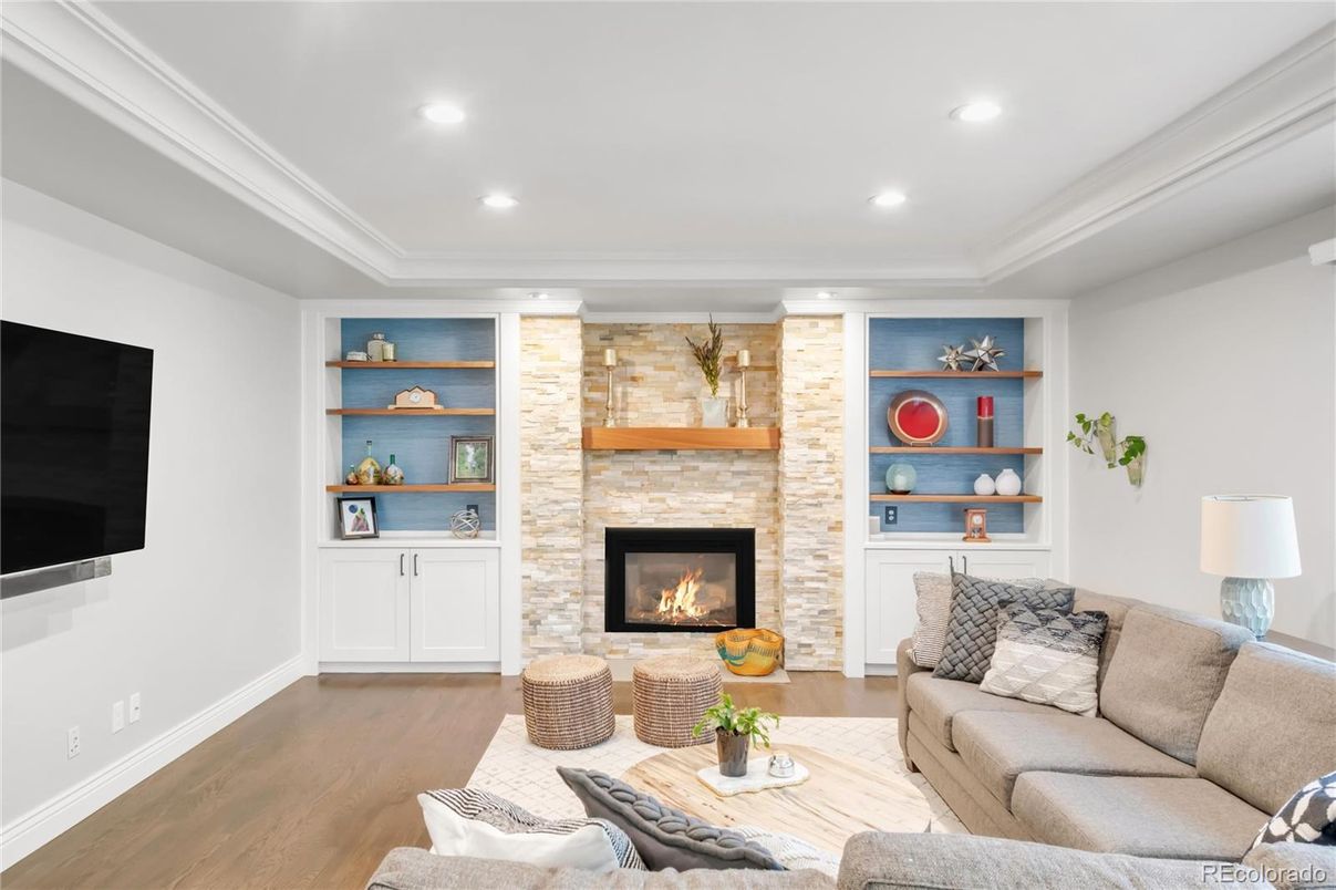 Fireplace, Interior, Living room, Recessed Lighting, Stone Walls, Wood Texture Flooring