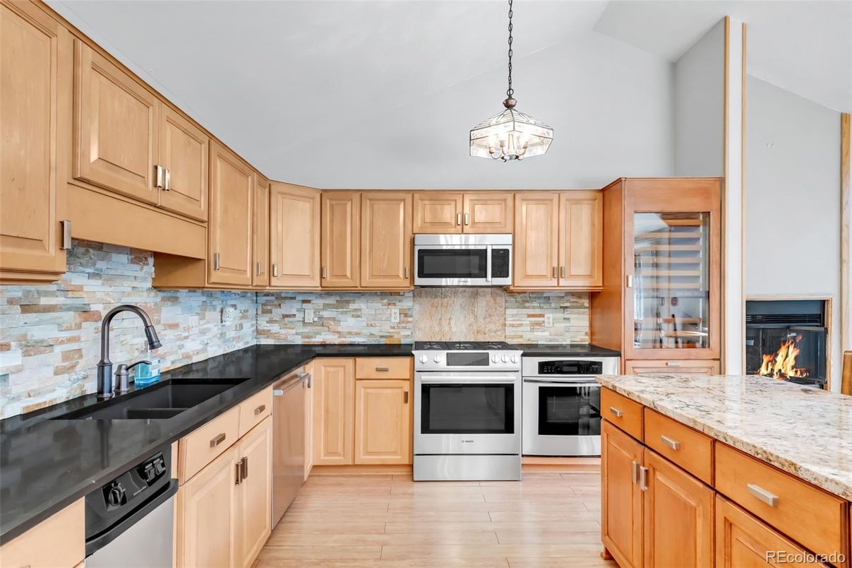 Fireplace, Interior, Kitchen, Pendant Lights, Stainless Steel Appliances, Wood Texture Flooring