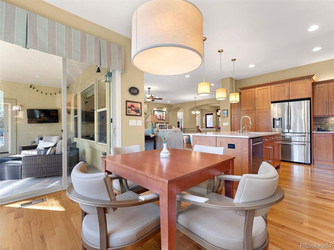 Dining room, Interior, Kitchen, Pendant Lights, Recessed Lighting, Stainless Steel Appliances, Wood Texture Flooring