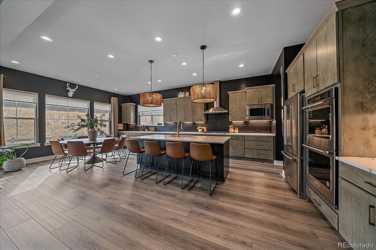 Dining room, Interior, Kitchen, Pendant Lights, Recessed Lighting, Stainless Steel Appliances, Wood Texture Flooring