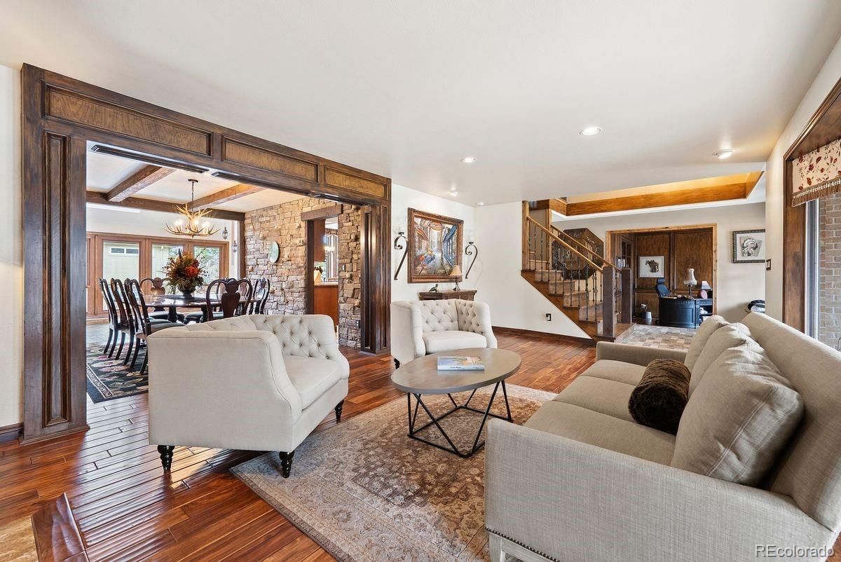 Chandelier, Dining room, Interior, Living room, Pendant Lights, Recessed Lighting, Stone Walls, Wood Texture Flooring