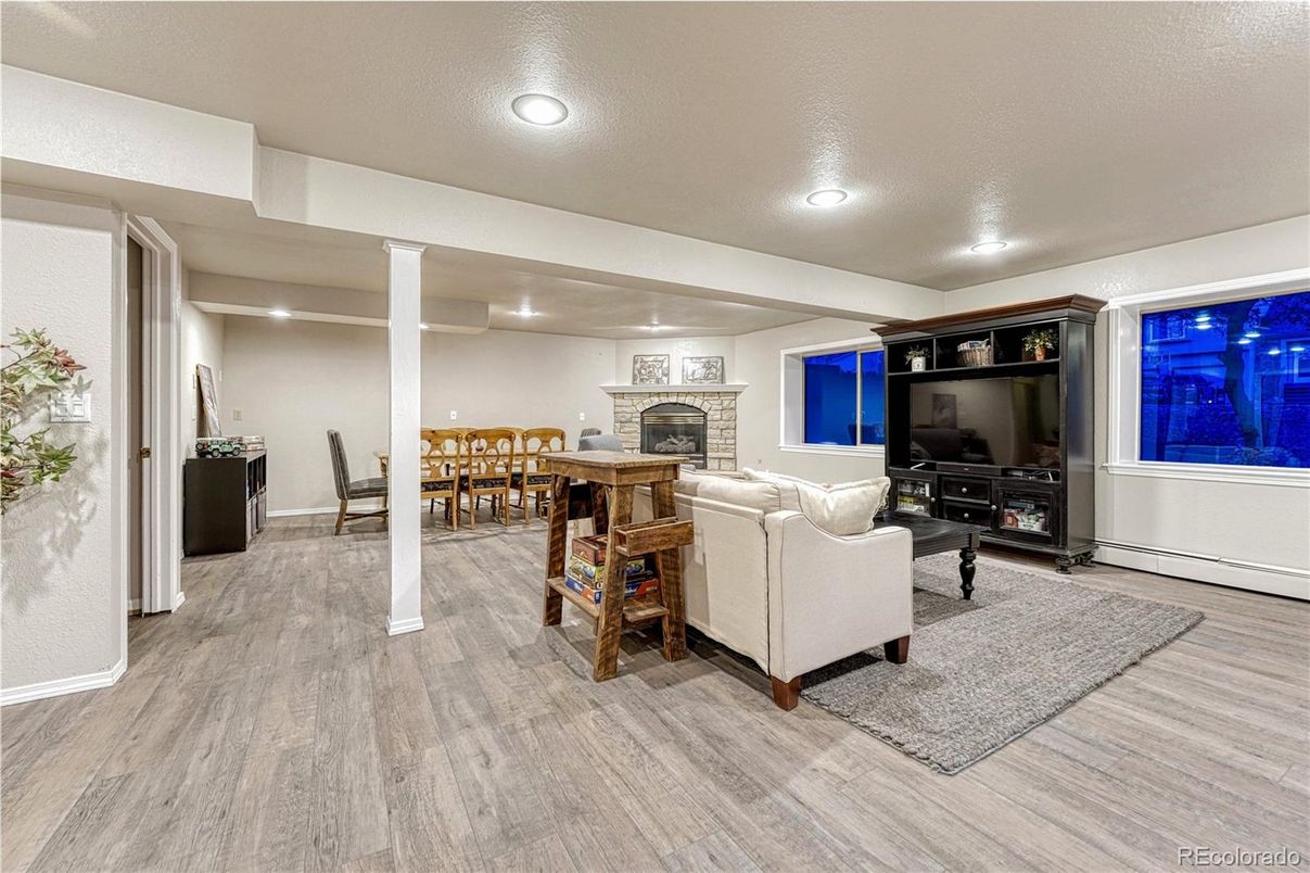 Dining room, Fireplace, Interior, Living room, Recessed Lighting, Wood Texture Flooring