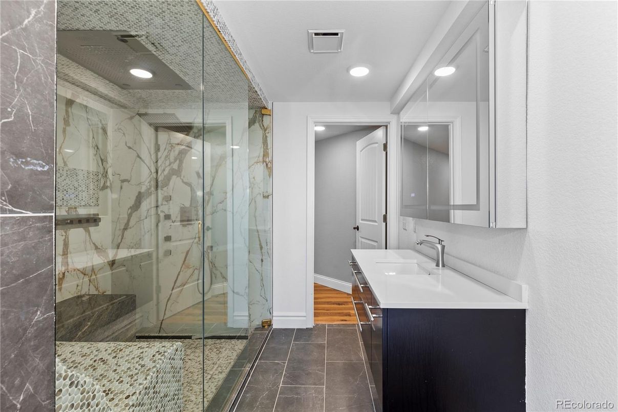 Bathroom, Glass Shower, Interior, Marble Walls, Recessed Lighting, Wood Texture Flooring