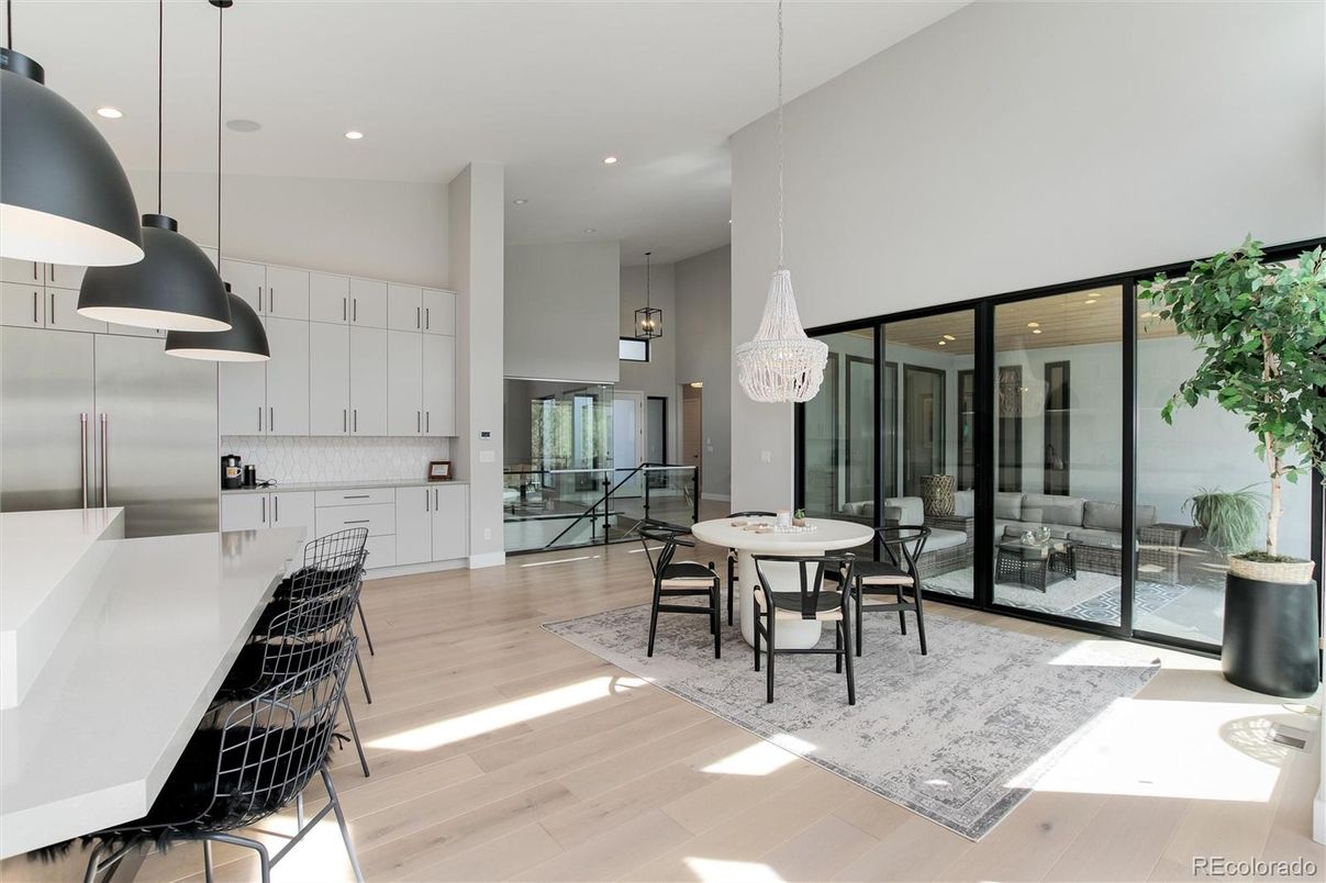 Chandelier, Dining room, Interior, Kitchen, Pendant Lights, Recessed Lighting, Stainless Steel Appliances, Wood Texture Flooring