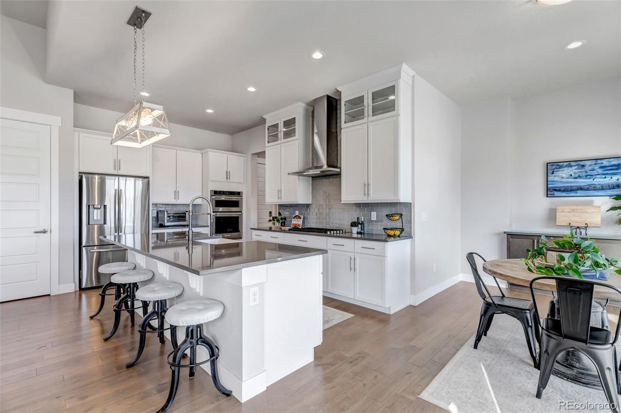 Dining room, Interior, Kitchen, Pendant Lights, Recessed Lighting, Stainless Steel Appliances, Wood Texture Flooring