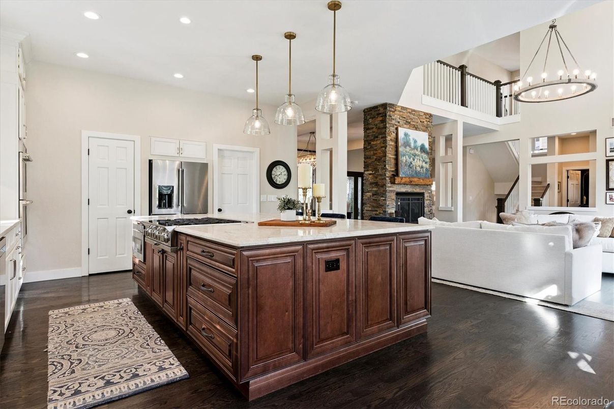 Fireplace, Interior, Kitchen, Living room, Pendant Lights, Recessed Lighting, Stainless Steel Appliances, Wood Texture Flooring