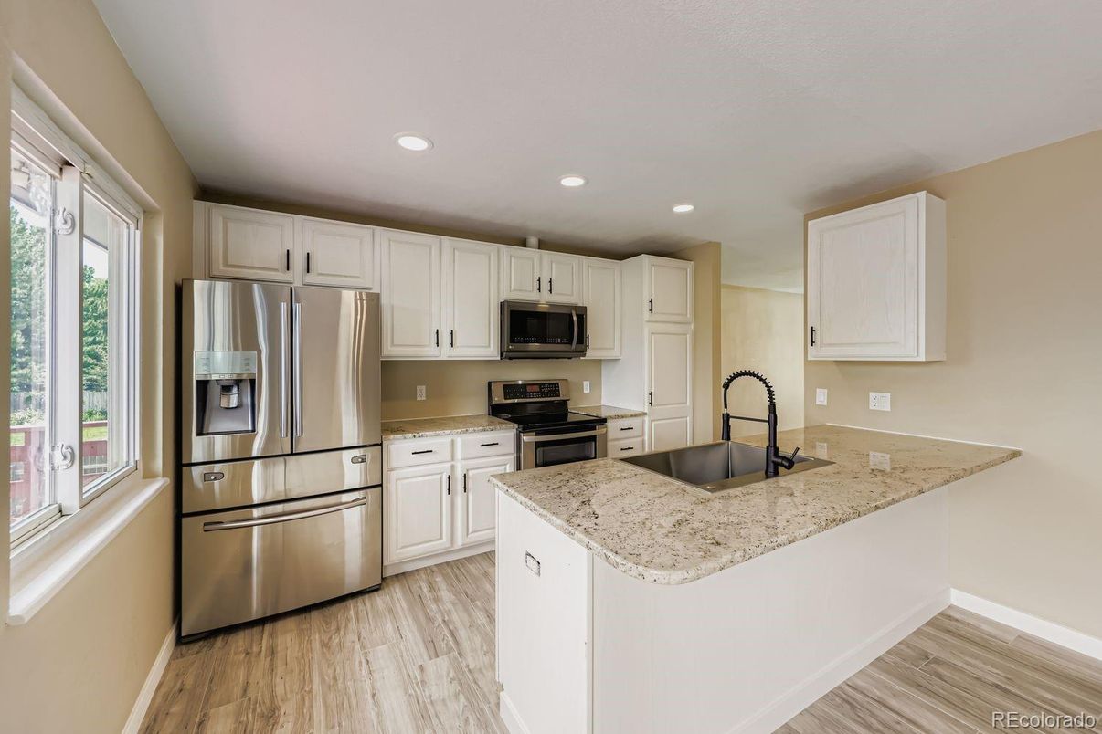 Interior, Kitchen, Recessed Lighting, Stainless Steel Appliances, Wood Texture Flooring