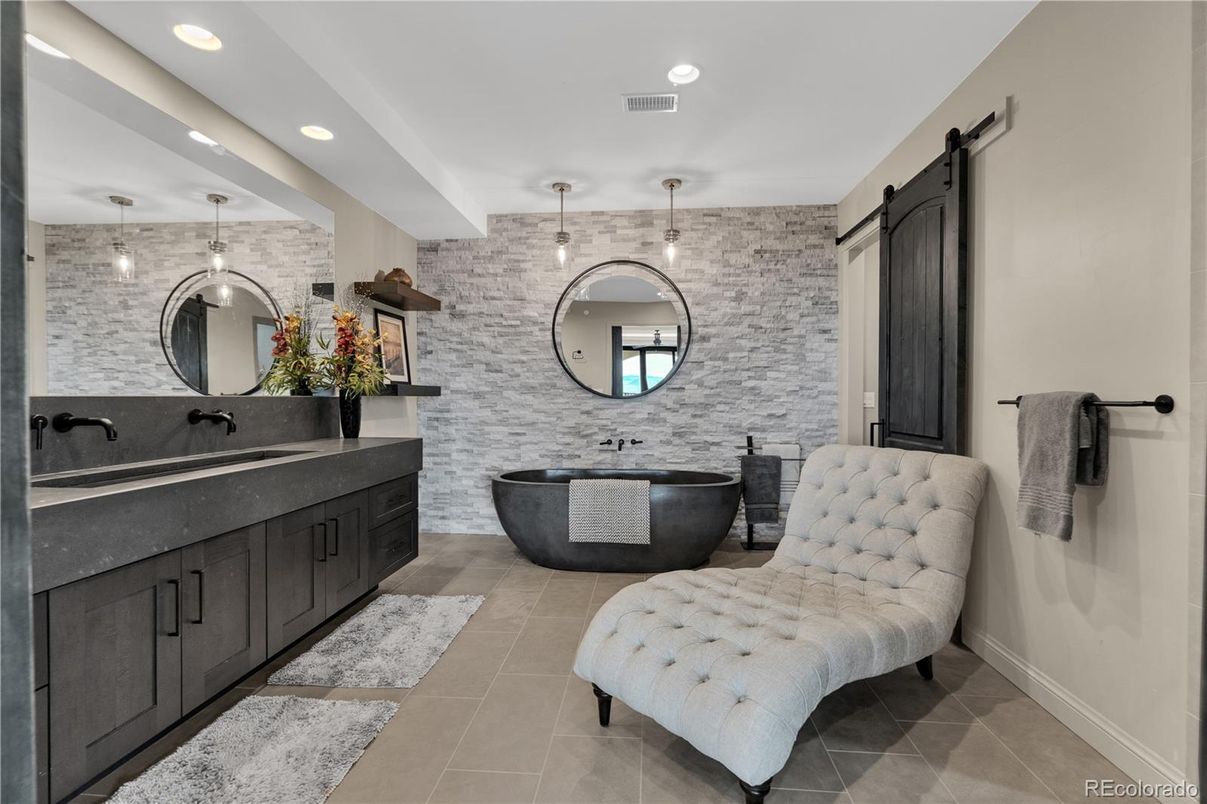 Bathroom, Dual Sink Vanities, Free Standing Baths, Interior, Pendant Lights, Recessed Lighting, Stone Walls