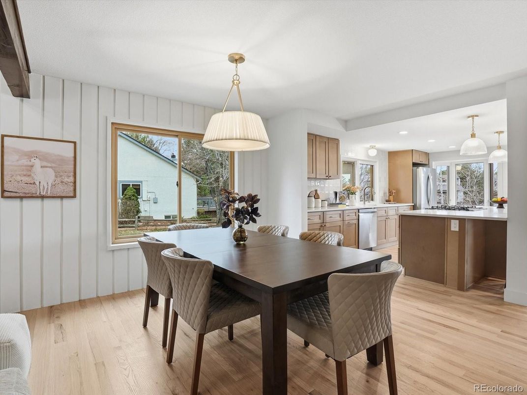Dining room, Interior, Kitchen, Pendant Lights, Recessed Lighting, Stainless Steel Appliances, Wood Texture Flooring