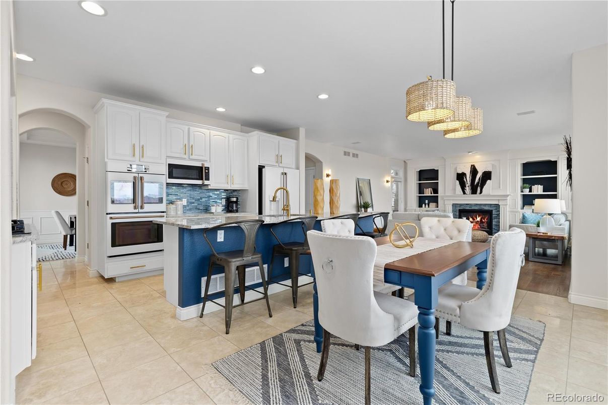 Chandelier, Dining room, Fireplace, Interior, Kitchen, Living room, Recessed Lighting, Stainless Steel Appliances
