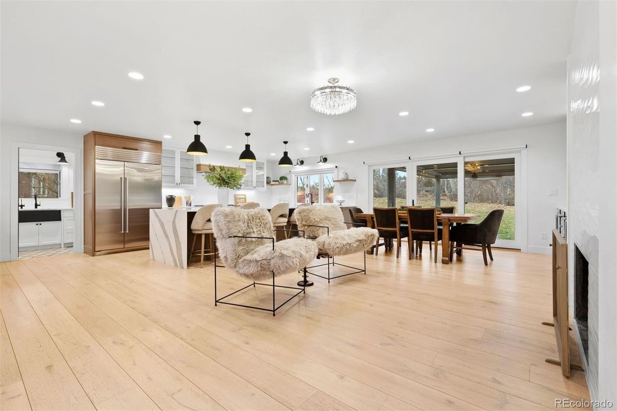 Chandelier, Dining room, Fireplace, Interior, Kitchen, Living room, Pendant Lights, Recessed Lighting, Stainless Steel Appliances, Wood Texture Flooring