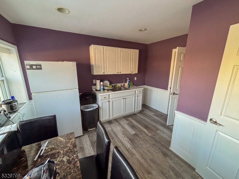 Interior, Kitchen, Recessed Lighting, Washer, Wood Texture Flooring