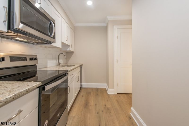 Interior, Kitchen, Recessed Lighting, Stainless Steel Appliances, Wood Texture Flooring