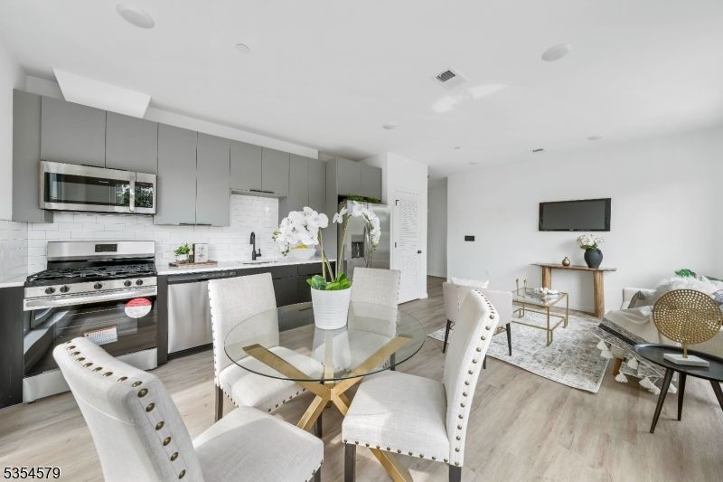 Dining room, Interior, Kitchen, Recessed Lighting, Stainless Steel Appliances, Wood Texture Flooring