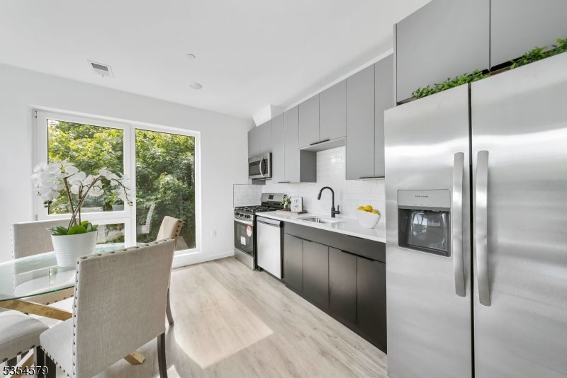 Dining room, Interior, Kitchen, Recessed Lighting, Stainless Steel Appliances, Wood Texture Flooring