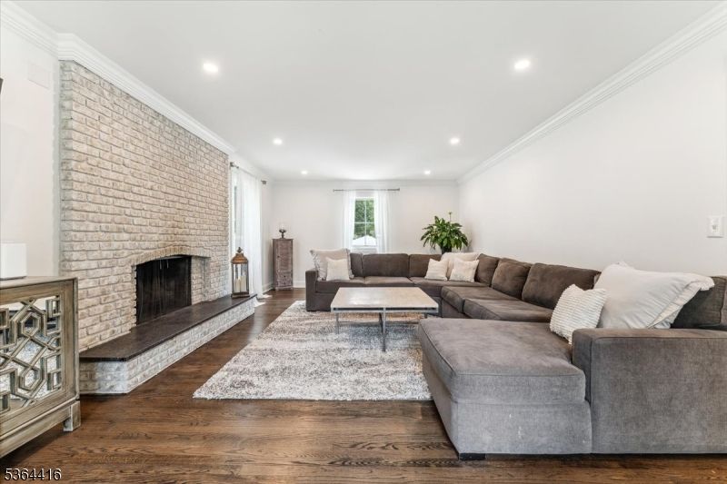 Fireplace, Interior, Living room, Recessed Lighting, Stone Walls, Wood Texture Flooring