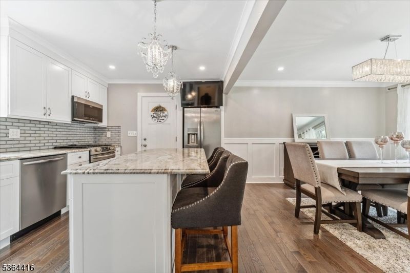 Chandelier, Dining room, Interior, Kitchen, Pendant Lights, Recessed Lighting, Stainless Steel Appliances, Wood Texture Flooring