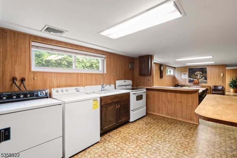 Interior, Kitchen, Recessed Lighting, Washer, Wooden Walls