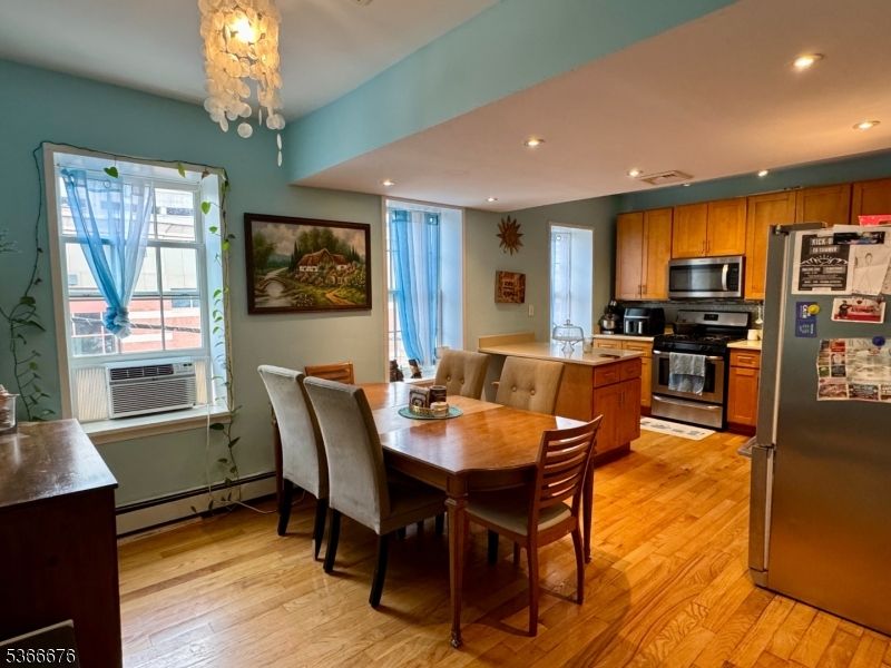 Chandelier, Dining room, Interior, Kitchen, Recessed Lighting, Stainless Steel Appliances, Wood Texture Flooring
