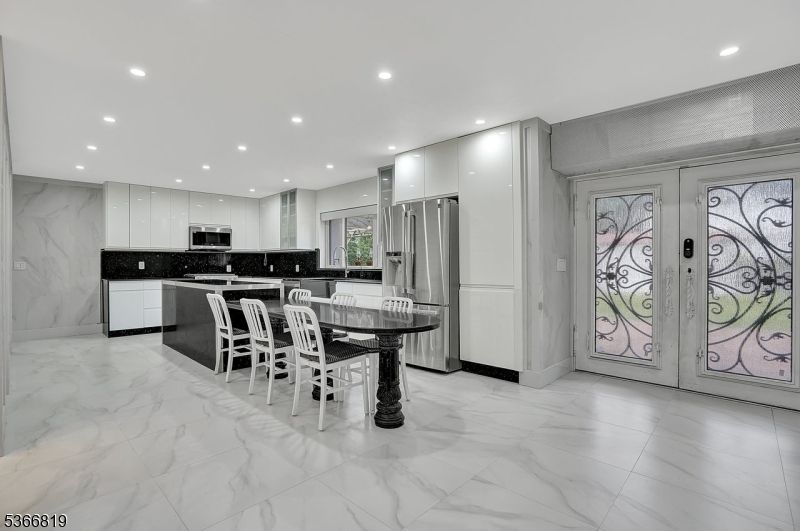Dining room, Interior, Kitchen, Marble, Marble Walls, Recessed Lighting, Stainless Steel Appliances