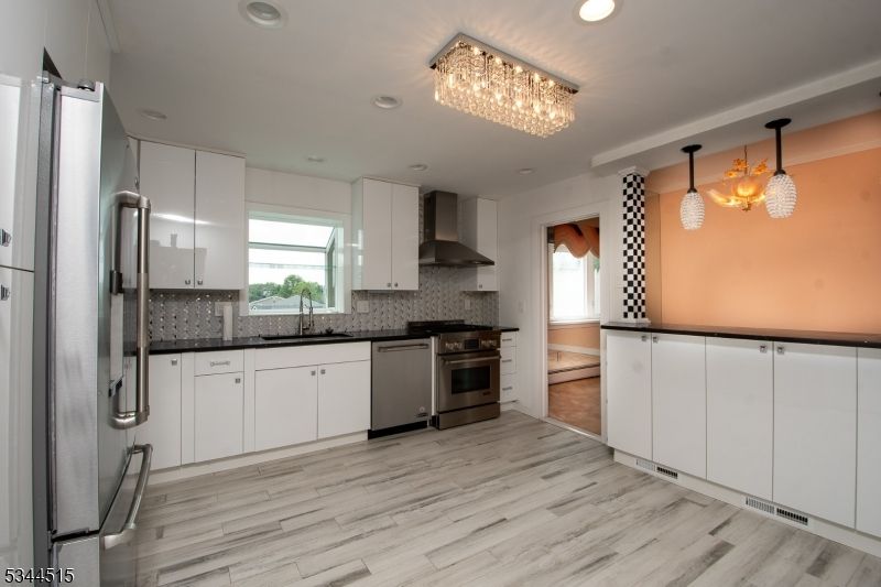 Chandelier, Interior, Kitchen, Pendant Lights, Recessed Lighting, Stainless Steel Appliances, Wood Texture Flooring