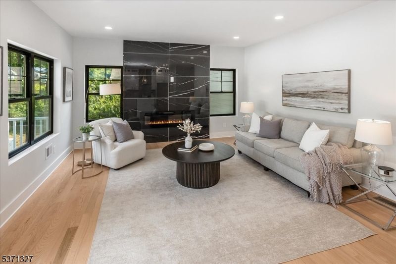 Fireplace, Interior, Living room, Marble Walls, Recessed Lighting, Wood Texture Flooring