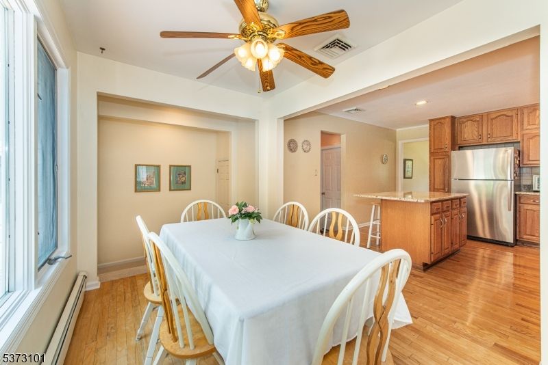 Dining room, Interior, Kitchen, Recessed Lighting, Stainless Steel Appliances, Wood Texture Flooring