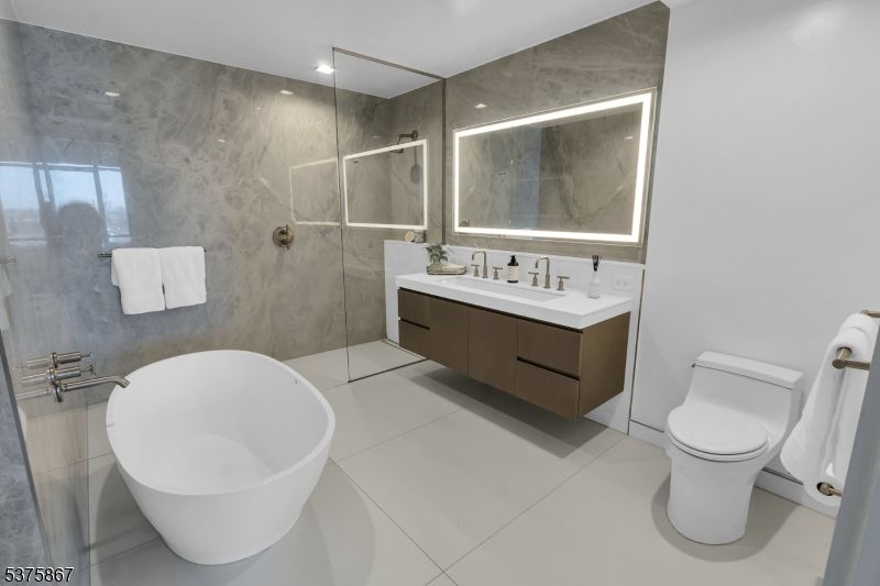 Bathroom, Dual Sink Vanities, Free Standing Baths, Glass Shower, Interior, Marble Walls, Recessed Lighting