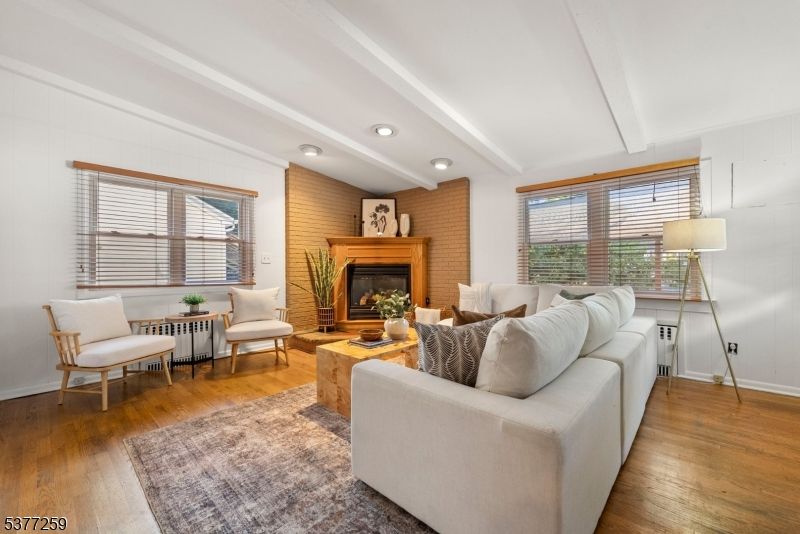 Fireplace, Interior, Living room, Recessed Lighting, Stone Walls, Wood Texture Flooring