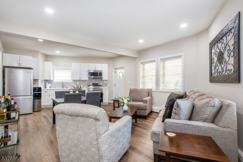 Dining room, Interior, Kitchen, Living room, Recessed Lighting, Stainless Steel Appliances, Wood Texture Flooring