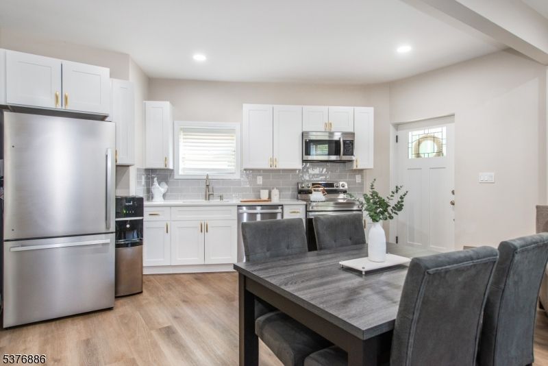 Dining room, Interior, Kitchen, Recessed Lighting, Stainless Steel Appliances, Wood Texture Flooring
